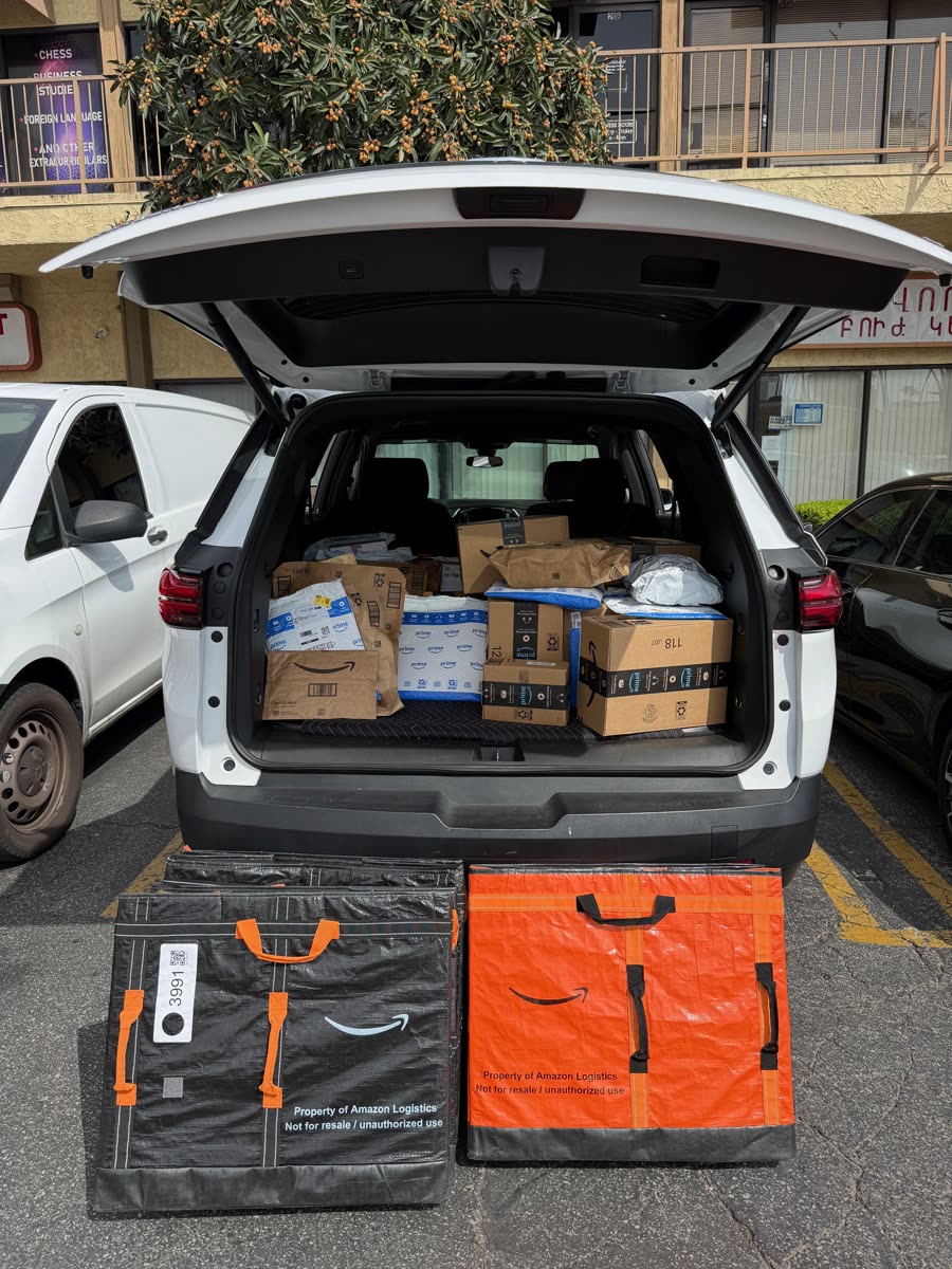 High-volume delivery route with parcels and Amazon containers